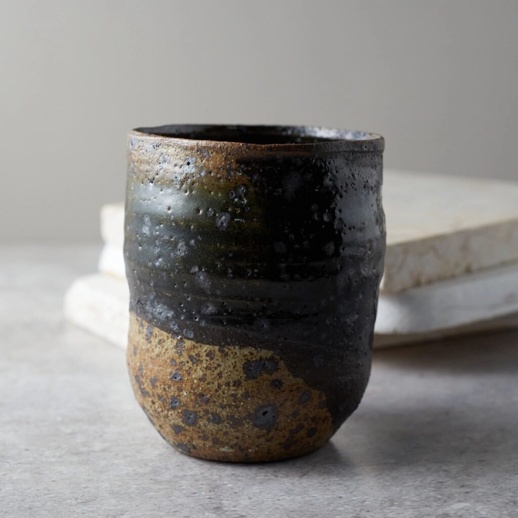 Close up ceramic cup on gray background